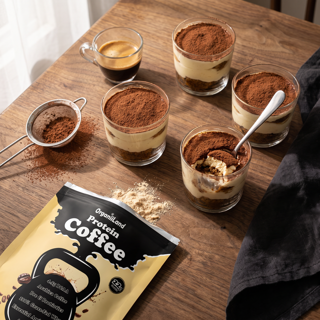 Four protein tiramisu cups dusted with cocoa beside an opened bag of OrganiiLand Original Protein Coffee