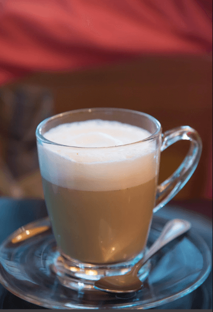 Hot vanilla protein latte in a warm mug