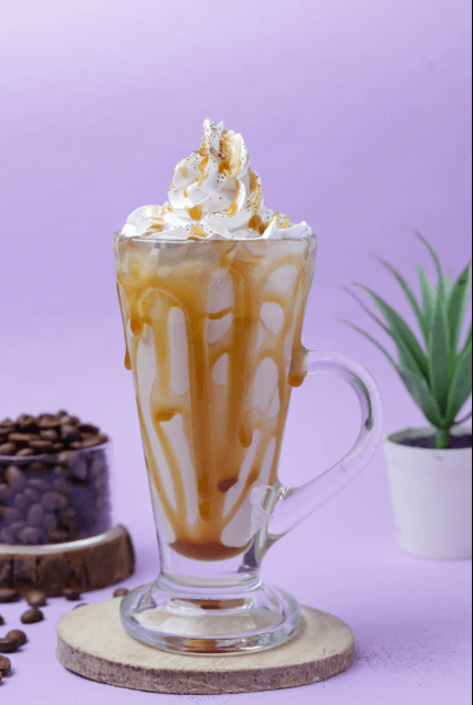Vanilla iced protein latte in a tall glass with ice