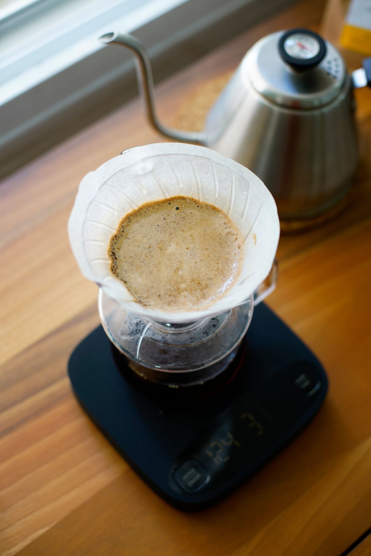 Overhead view of coffee brewing in a pour-over dripper