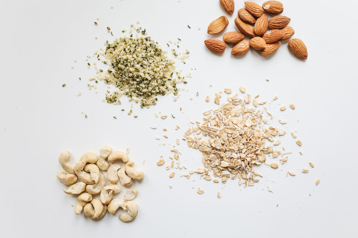 Brown and white nuts on a white surface